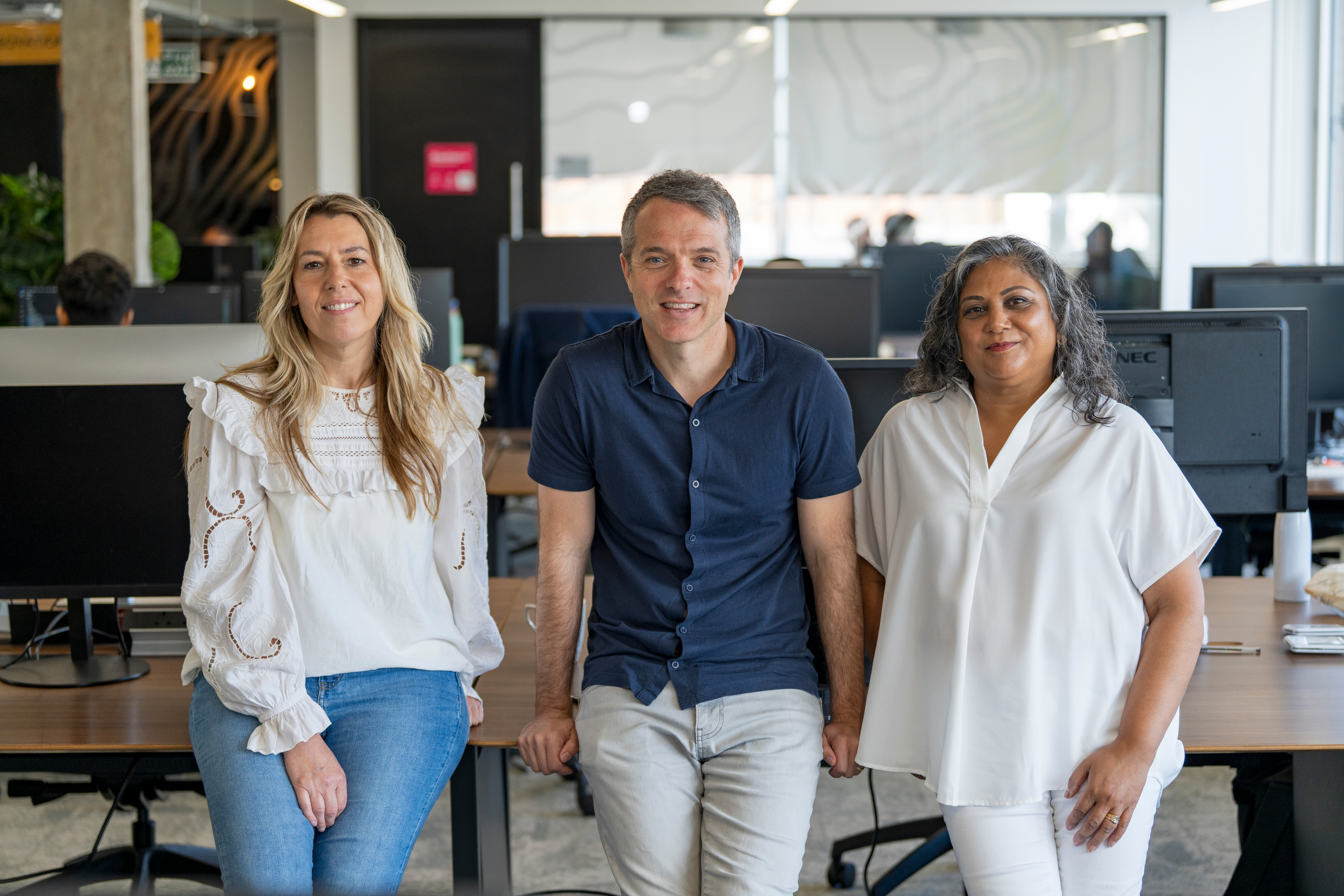 A image of a concrete sphere, balanced between two other larger spheres